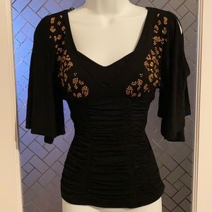 XOXO Fitted “Cold Shoulder” Top with Flared Sleeves and Rhinestone Cheetah Print